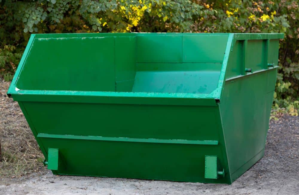 Big, green, empty skip bin.