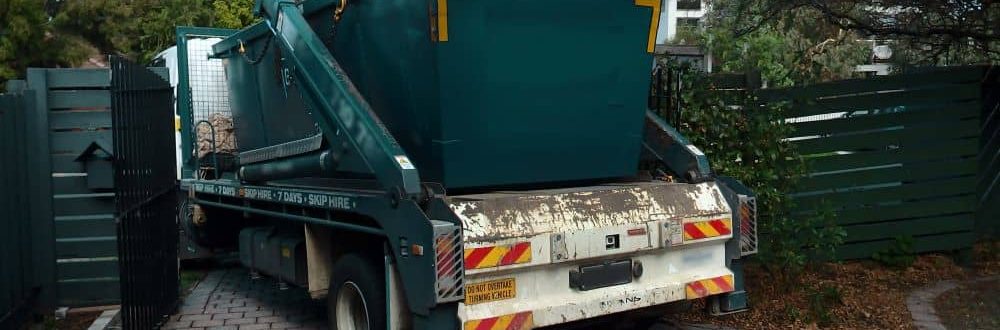 Hired skip bin being delivered to back yard.