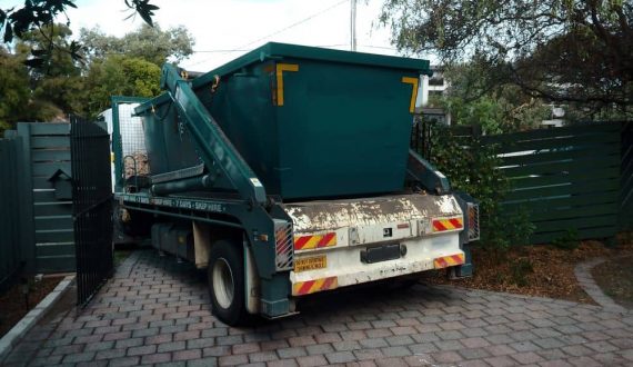 Hired skip bin being delivered to back yard.