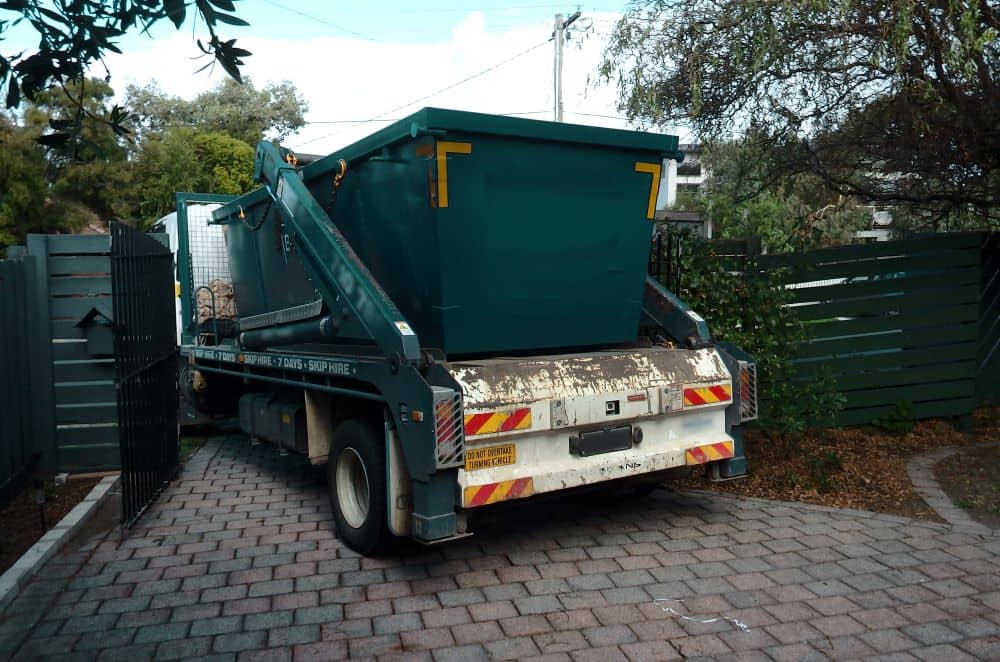 Hired skip bin being delivered to back yard.