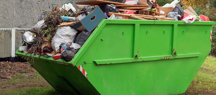 Full skip bin, after renovation. Full of rubbish and waste for unnecessary cluttering