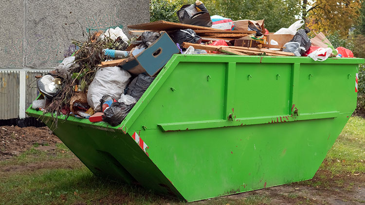 Full skip bin, after renovation. Full of rubbish and waste for unnecessary cluttering