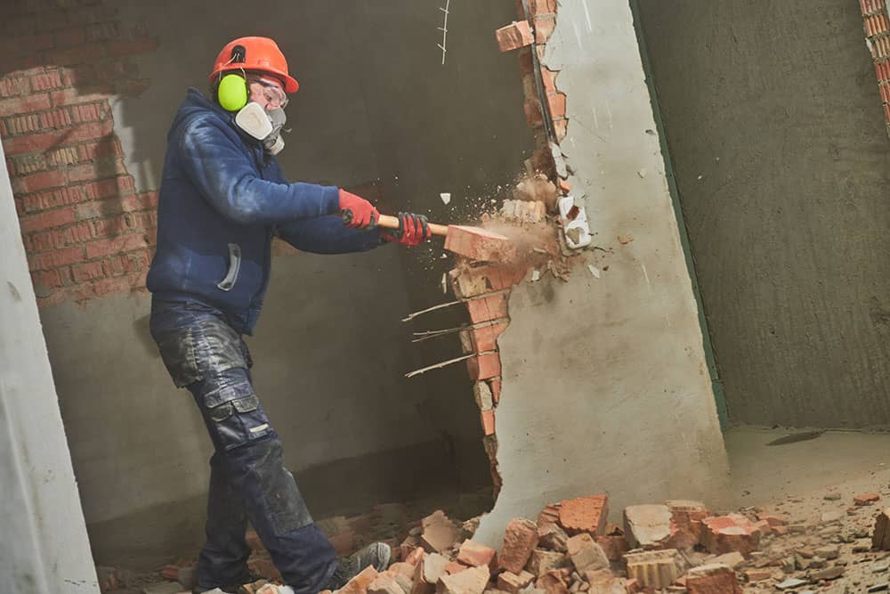 worker stripping out shop