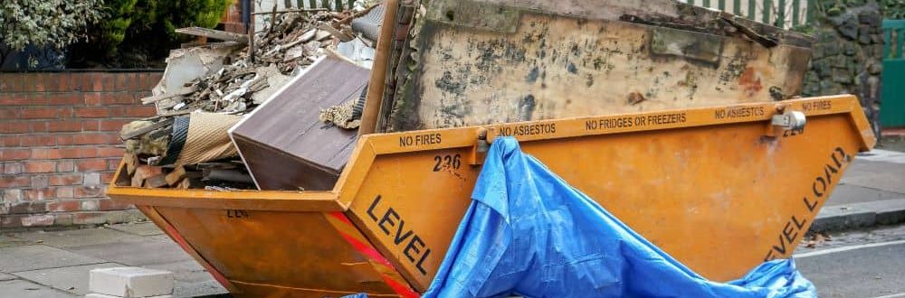 Yellow skip binned, place outside front yard full of waste from home renovation