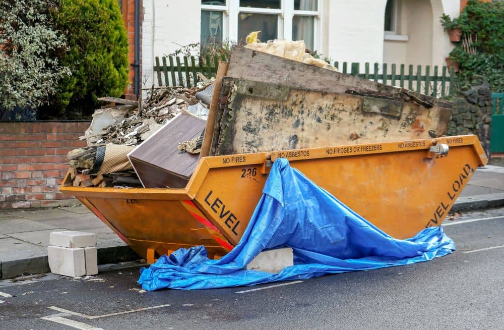 Yellow skip binned, place outside front yard full of waste from home renovation