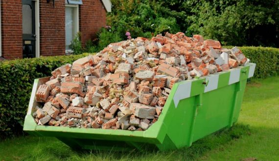 Safely stacked oversized skip bins for larger goods. Full of bricks and construction waste.