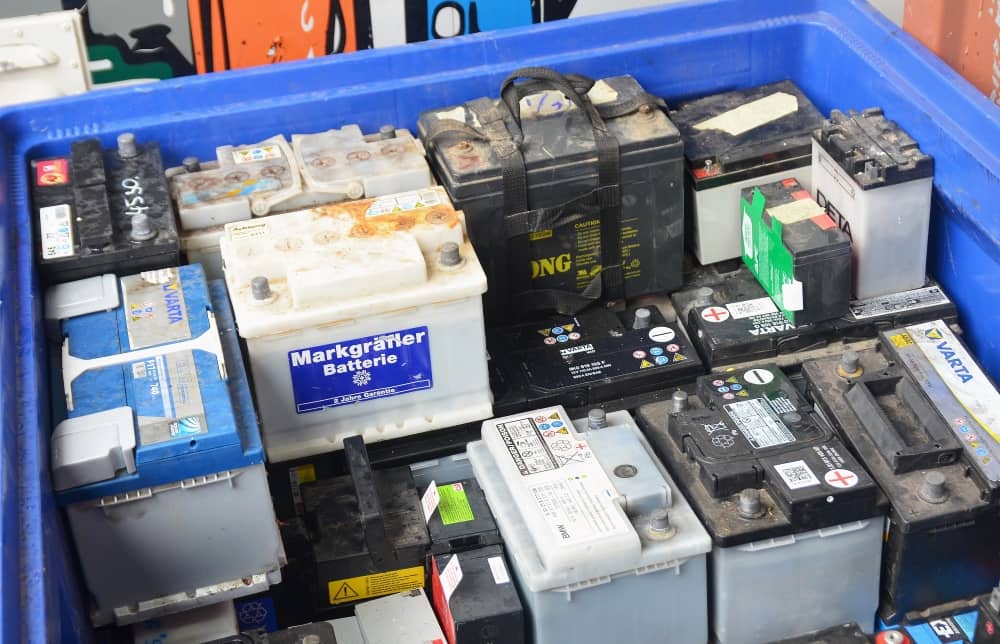 Used car batteries at a recycling facility.
