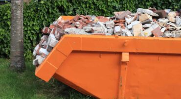 Skip bin full of bricks and construction waste as an example of what skip bin size do I need