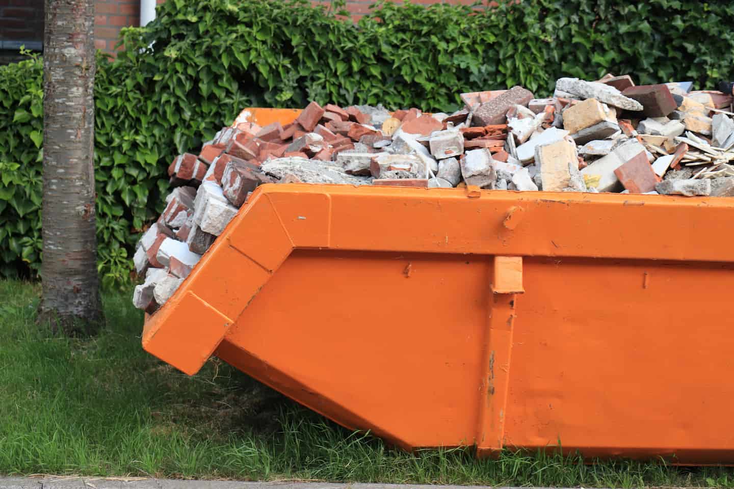 Skip bin full of bricks and construction waste as an example of what skip bin size do I need