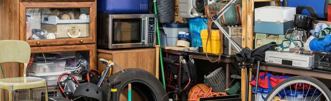 A garage room full of clutter demonstrating how to start decluttering when overwhelmed